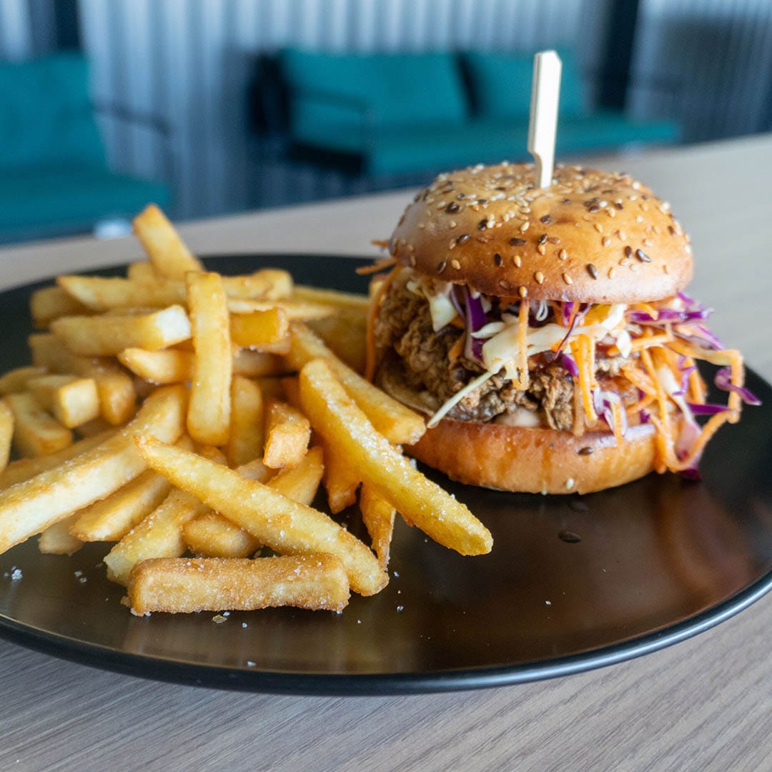 02. Buttermilk Chix Burger Chicken burger and chips on a plate