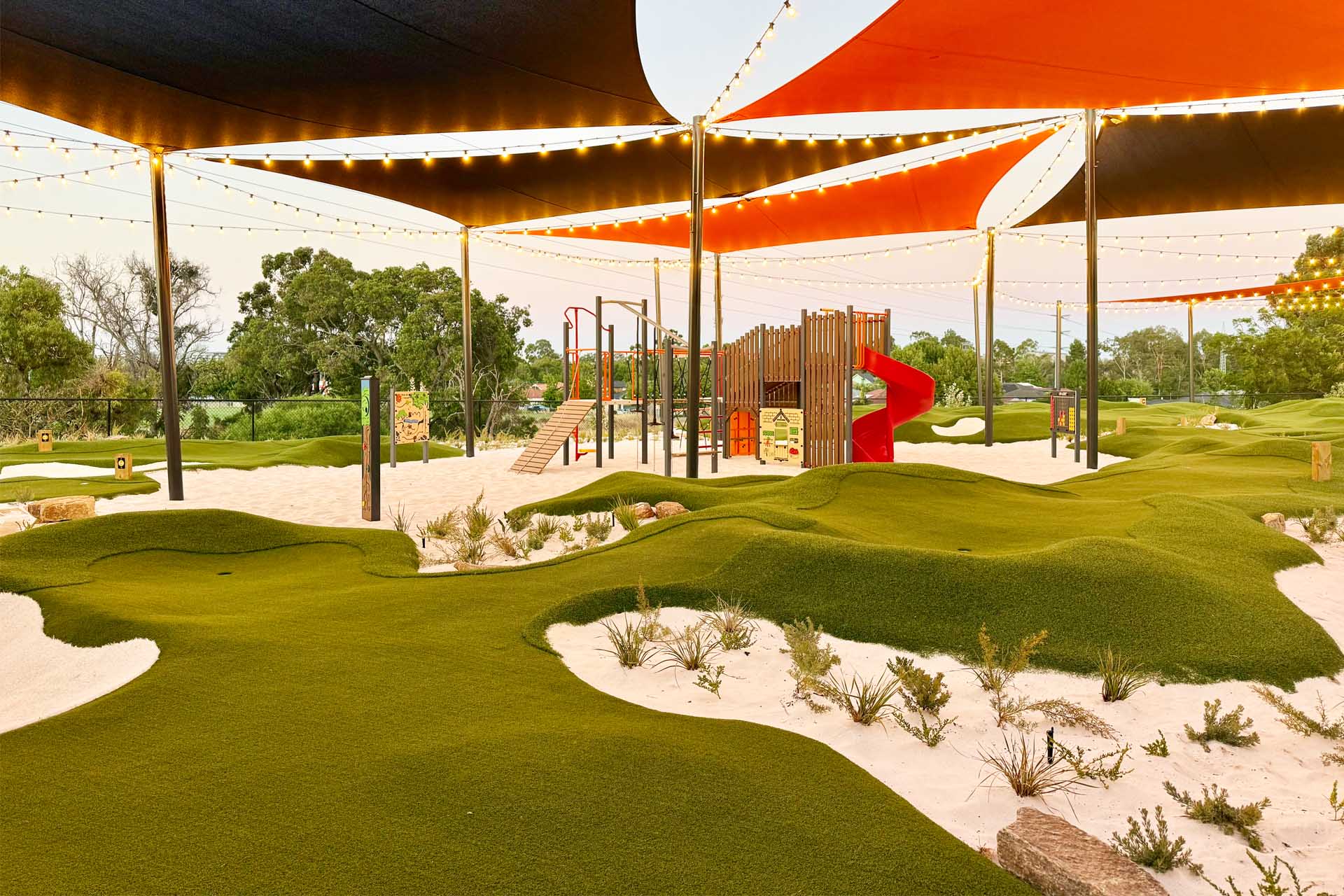 Mini Golf at OuttaBounds Mini golf course with rolling hills, sand dunes and shade sails