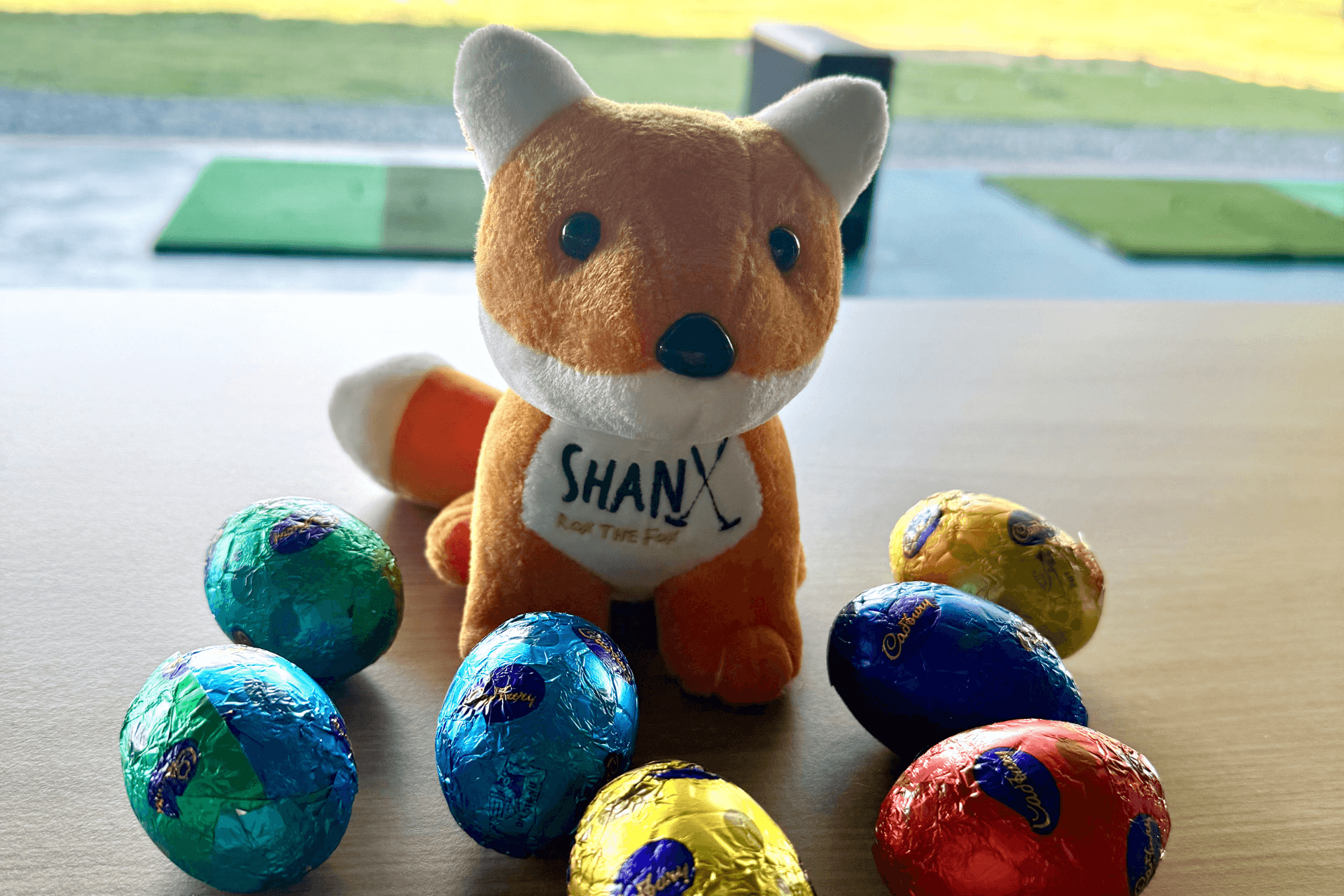 Rox the Fox on table with easter eggs Rox the Fox on Table