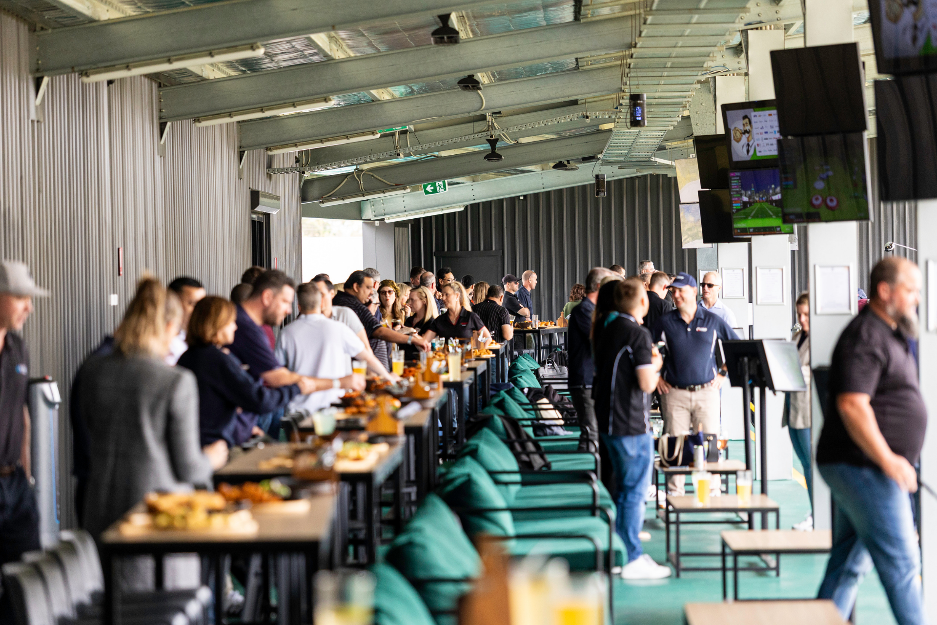 People enjoying food and playing golf at OuttaBounds