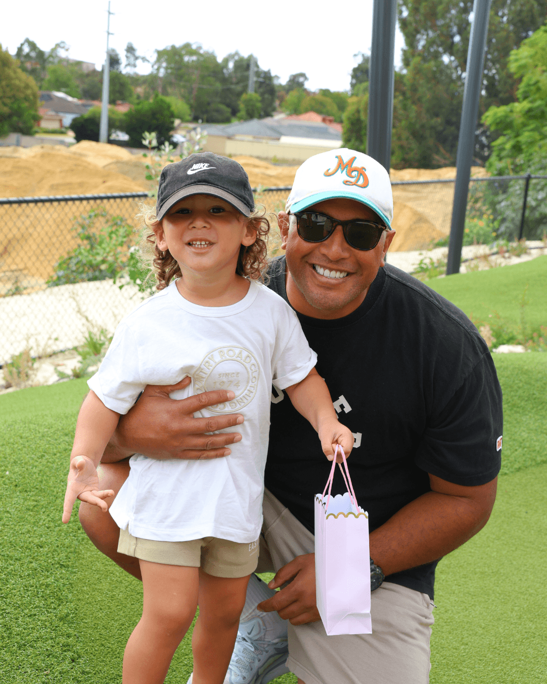 Father and Son Enjoying Mini Golf at OuttaBounds Easter Event Perth Child playing mini golf at OuttaBounds