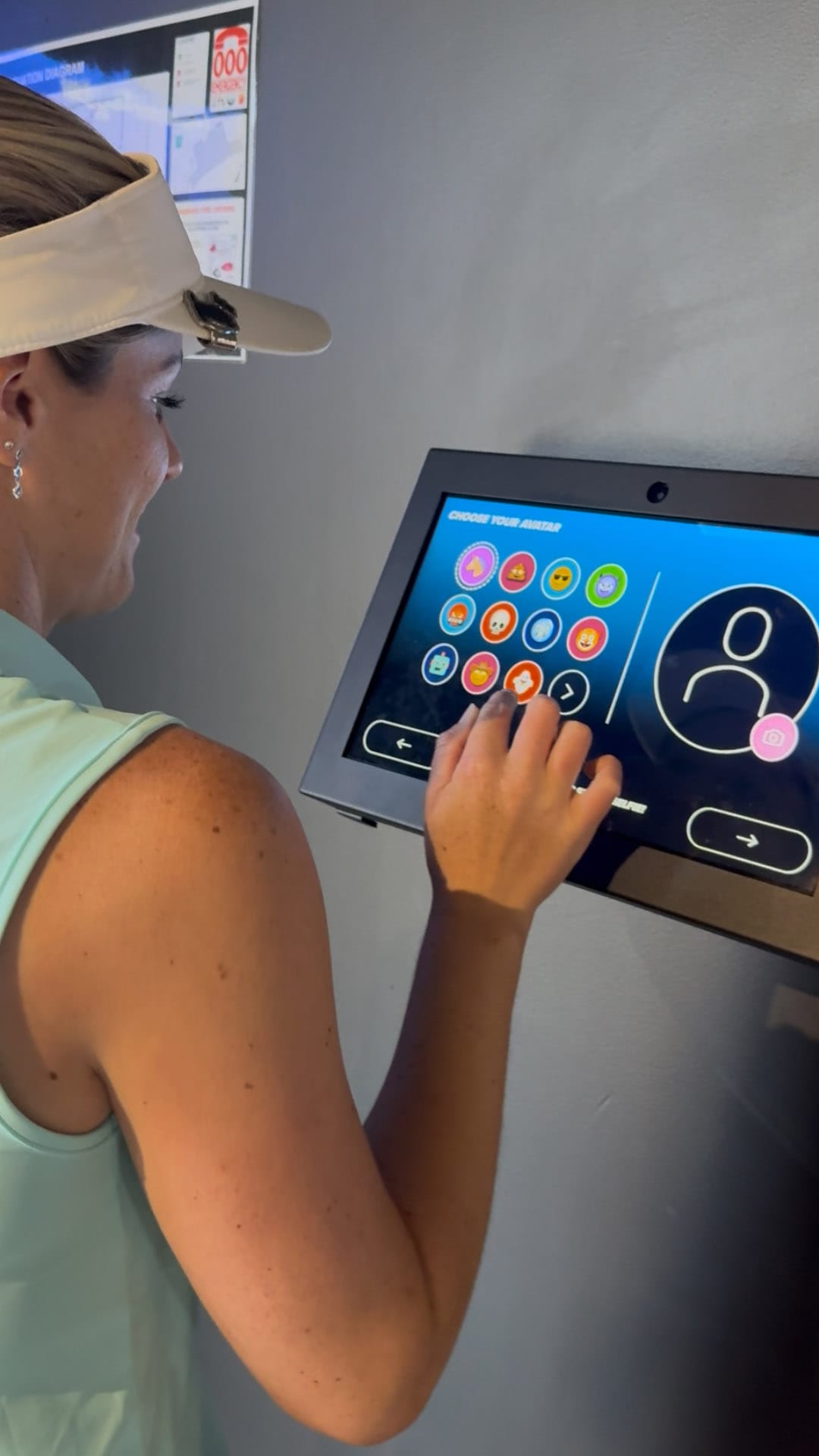 Lady selecting a game on the AR Darts control console