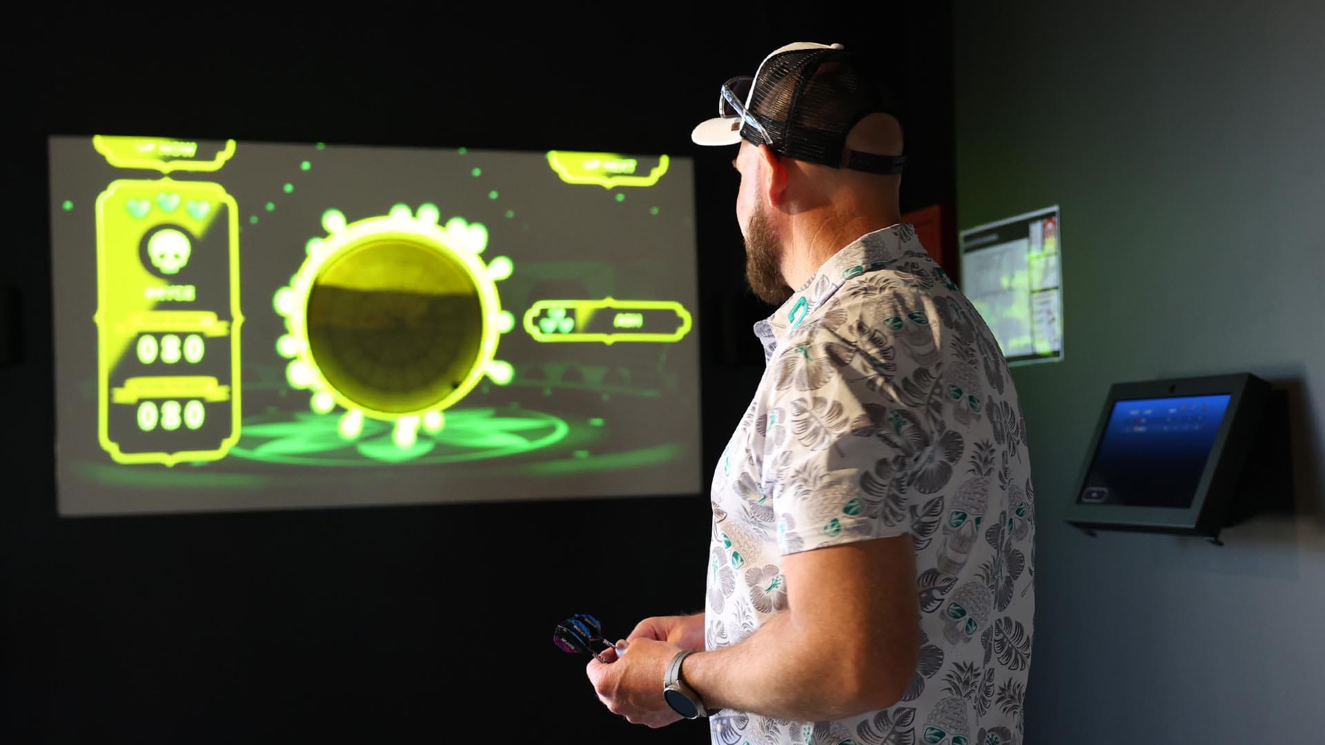 Man playing AR darts at OuttaBounds