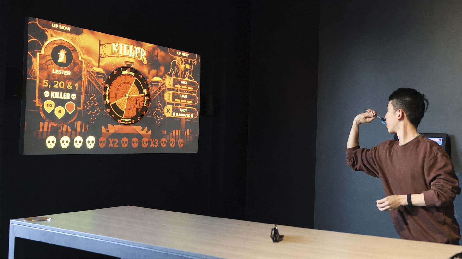 Young adult playing darts