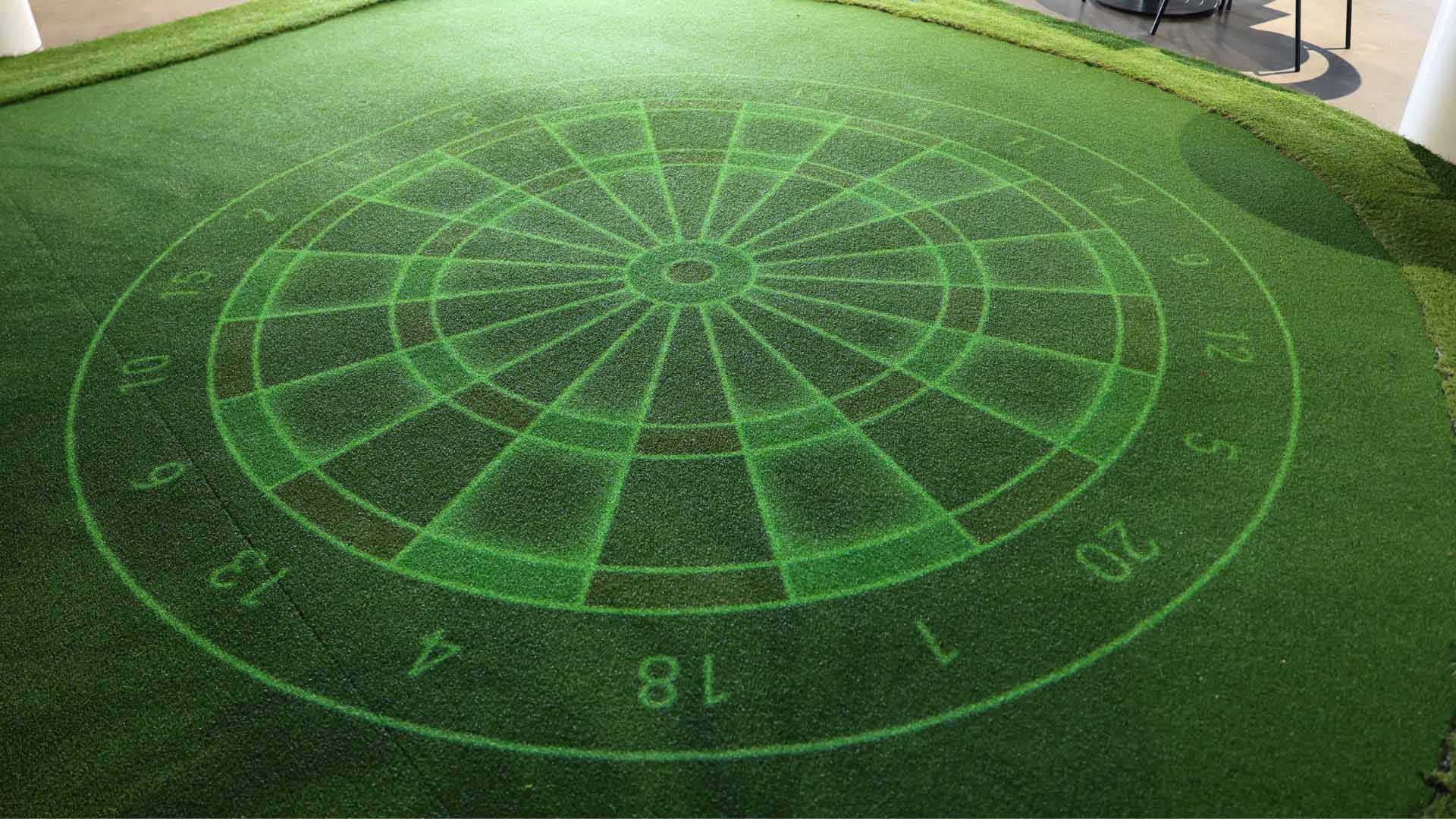 Dart board projected onto putting green
