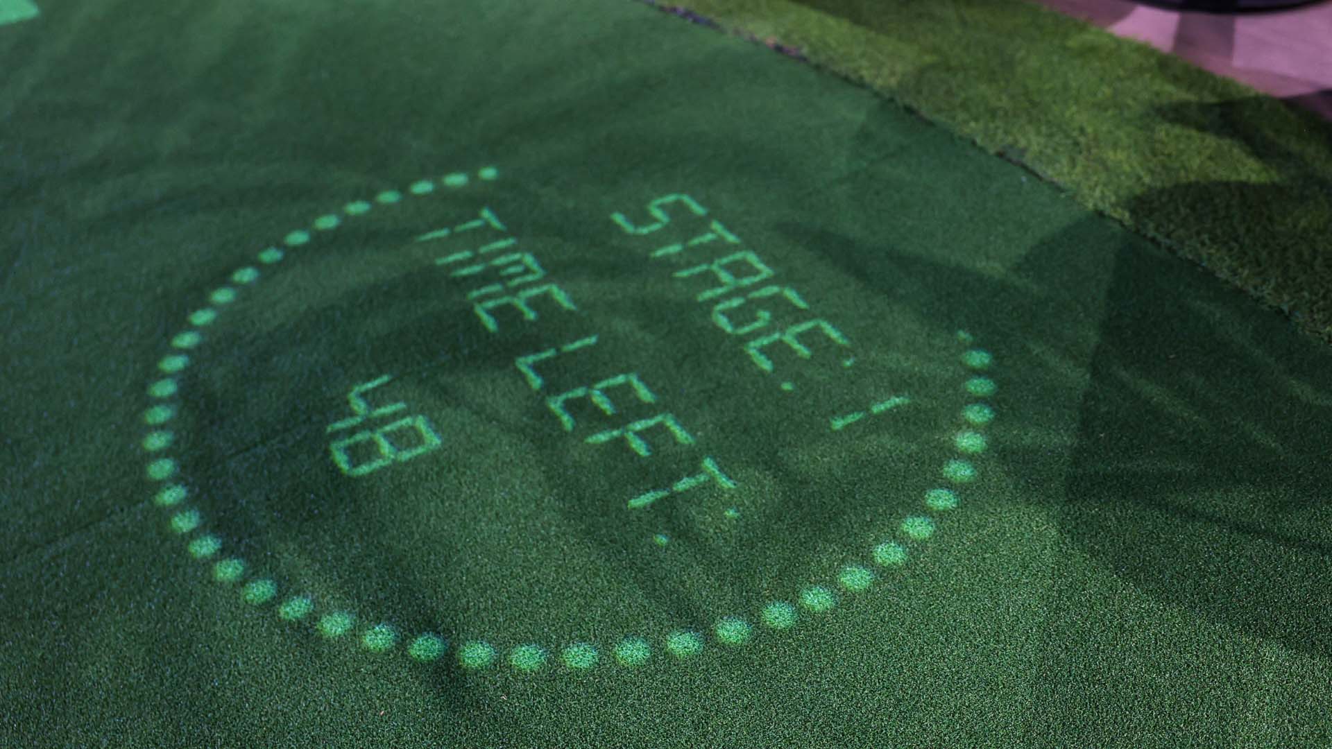 Real-time game response projected onto putting green