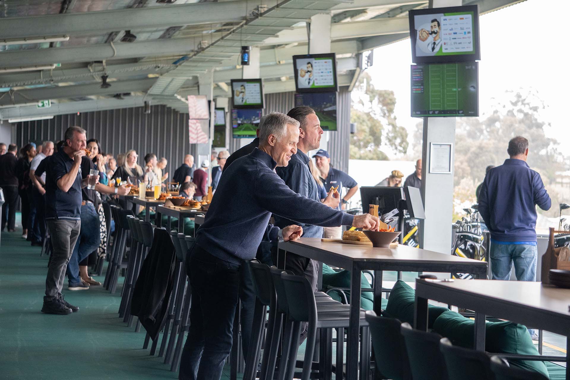 Guests enjoying food and play at exclusive lockout event at OuttaBounds