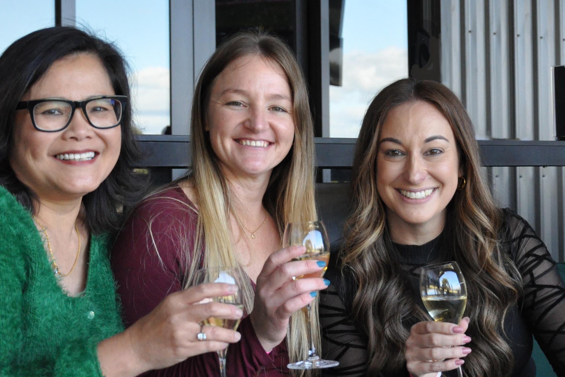 Ladies enjoying wine at corporate event at OuttaBounds