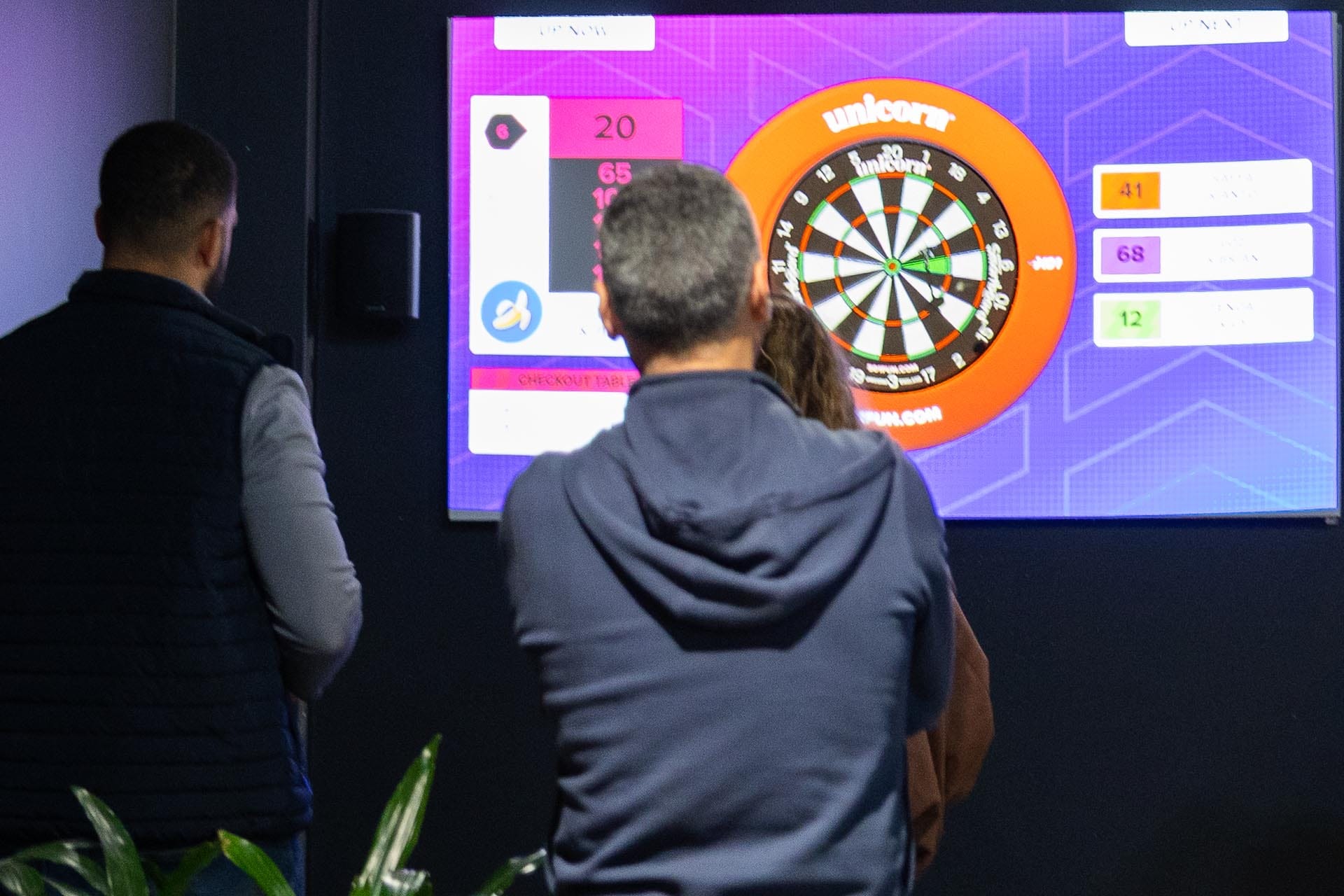 Group playing AR Darts at OuttaBounds