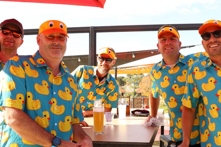 Group of men celebrating a bucks party with beer