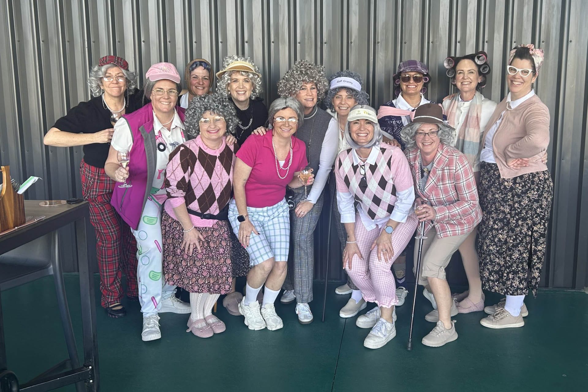 Ladies dressed up at OuttaBounds enjoying a golf event