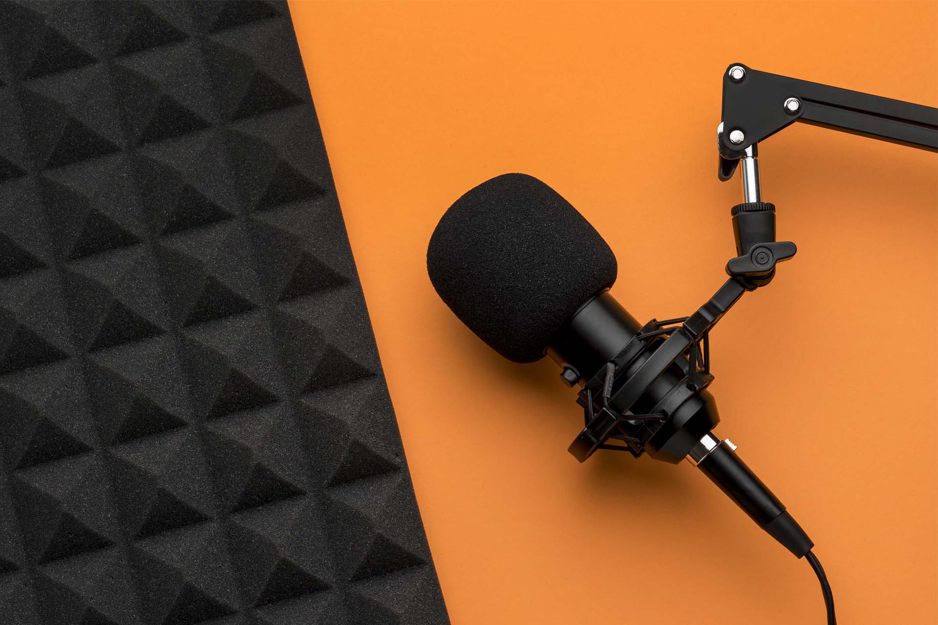 OuttaBounds-In-the-Media-Header Podcast mat lying next to acoustic isolation foam